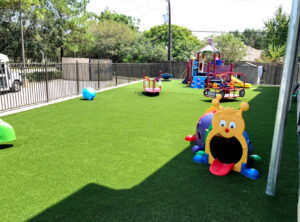 playground with artificial turf installation