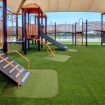 Multi colored jungle gym equipment installed on SYNLawn Artificial Grass