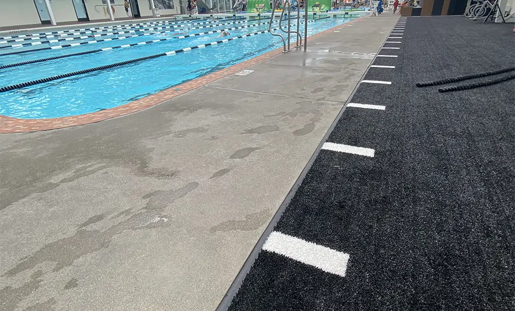 Artificial grass mat next to pool